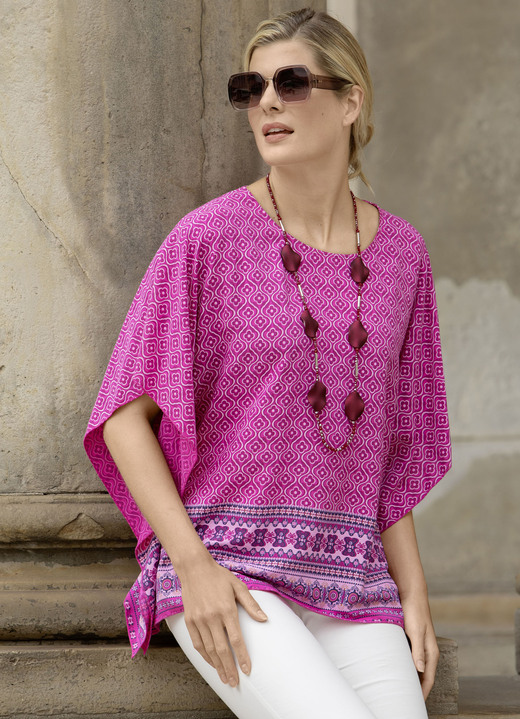 - Ponchotunika med tunn ärm, i storlek 036 till 052, i färg FUCHSIA FÄRGERIGT