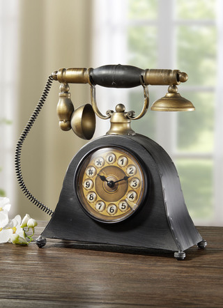 Bordsklocka i metall telefon