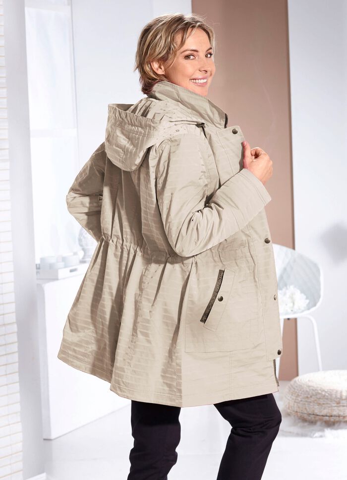 Funktionell jacka med en subtil randig design 