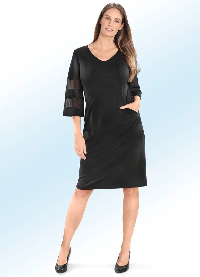 Kl&auml;nning med trumpet&auml;rmar 