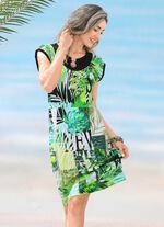 Kl&auml;nning med bl&auml;ckstr&aring;letryck och nedhasade &auml;rmar 