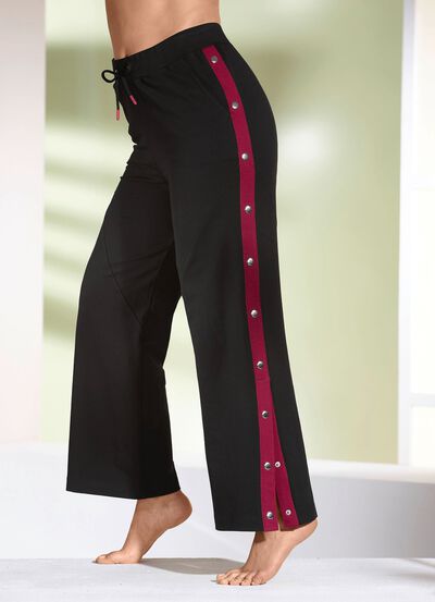 Byxor med knappar i sidan 