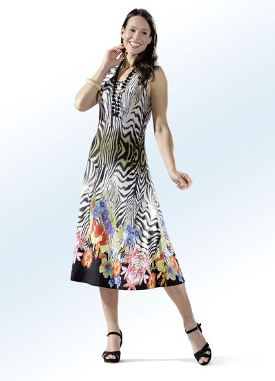 Kl&auml;nning med kanttryck 