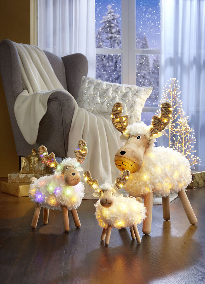 Belyst bordsdekoration i metall 