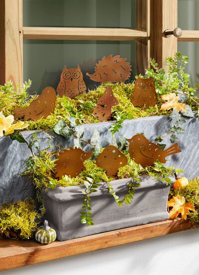 Dekorpluggar av rostig metall, set om 8 