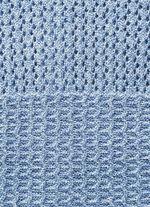 Stickad kofta med intrikat m&ouml;nstermix 