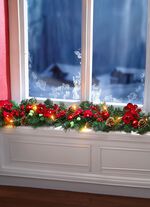 Upplyst girlang med grangrenar 