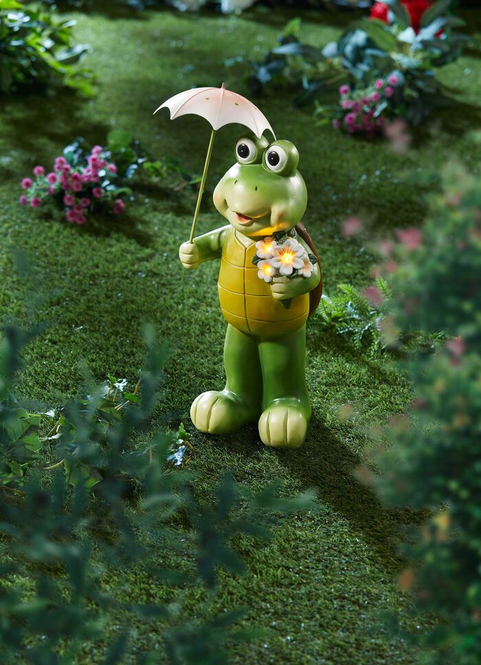 Sk&ouml;ldpadda med solblomma och paraply 