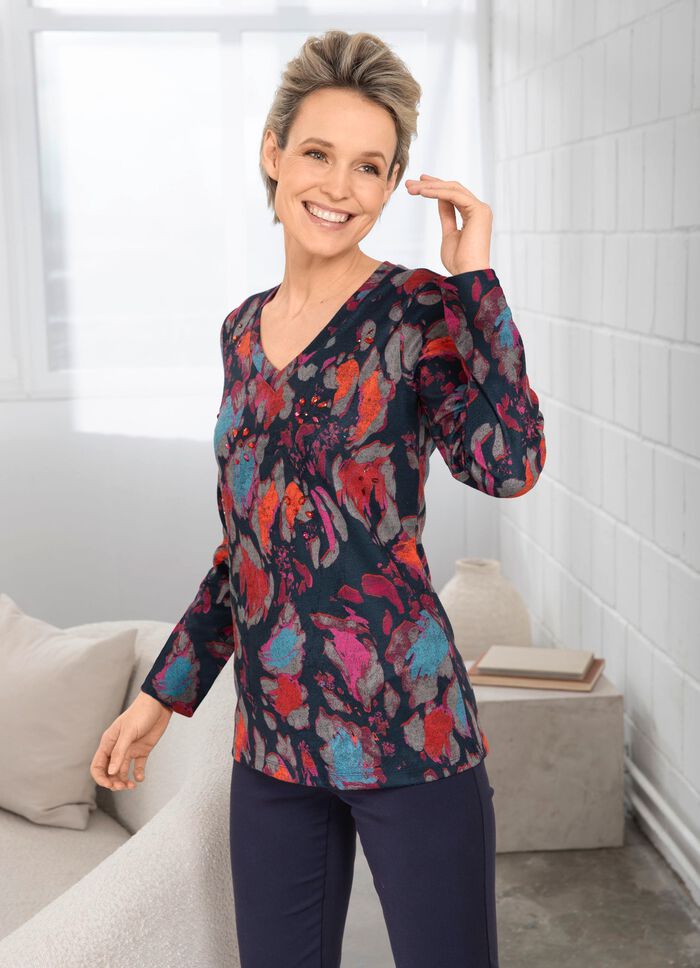 Skjorta med dekorativa stenar p&aring; framsidan 