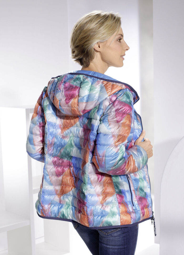 Funktionell vändbar jacka med fast huva 