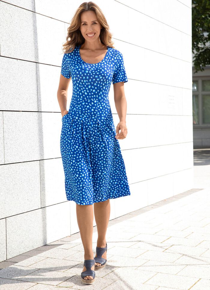 Kl&auml;nning med 2 slitsfickor 