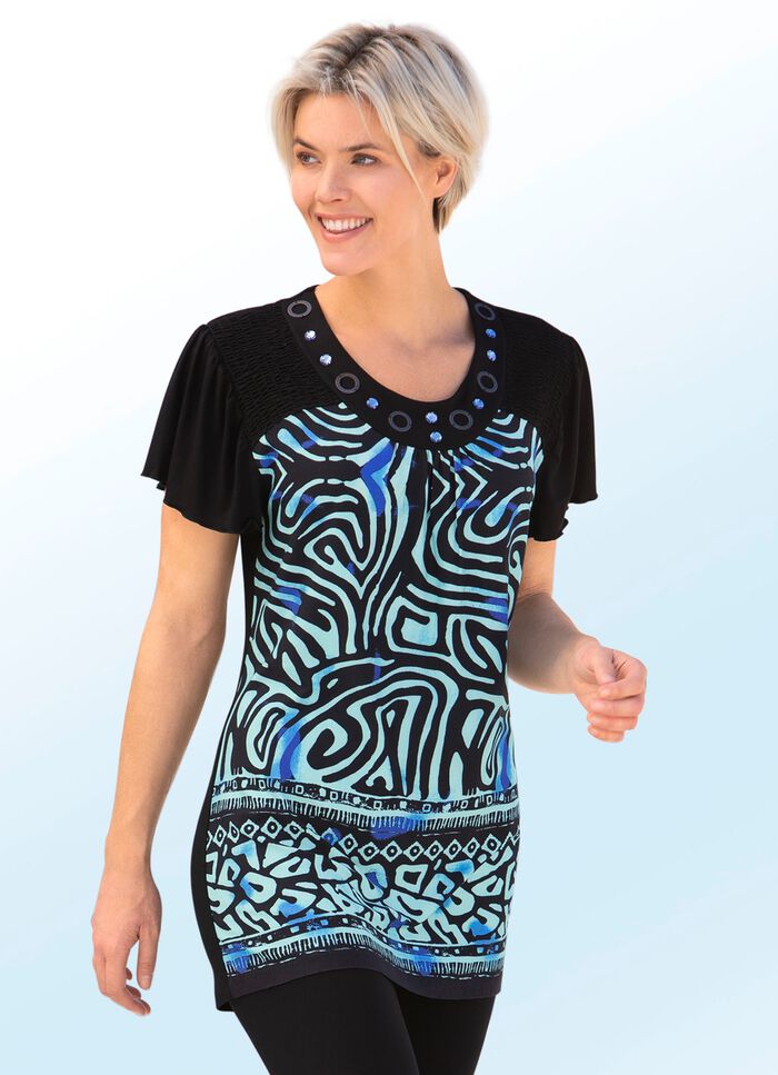 Tunika med dekorativa ringar och &auml;delstenar 