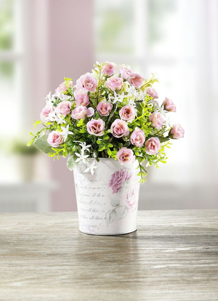 Arrangemang med minibuketter i en metallkruka 