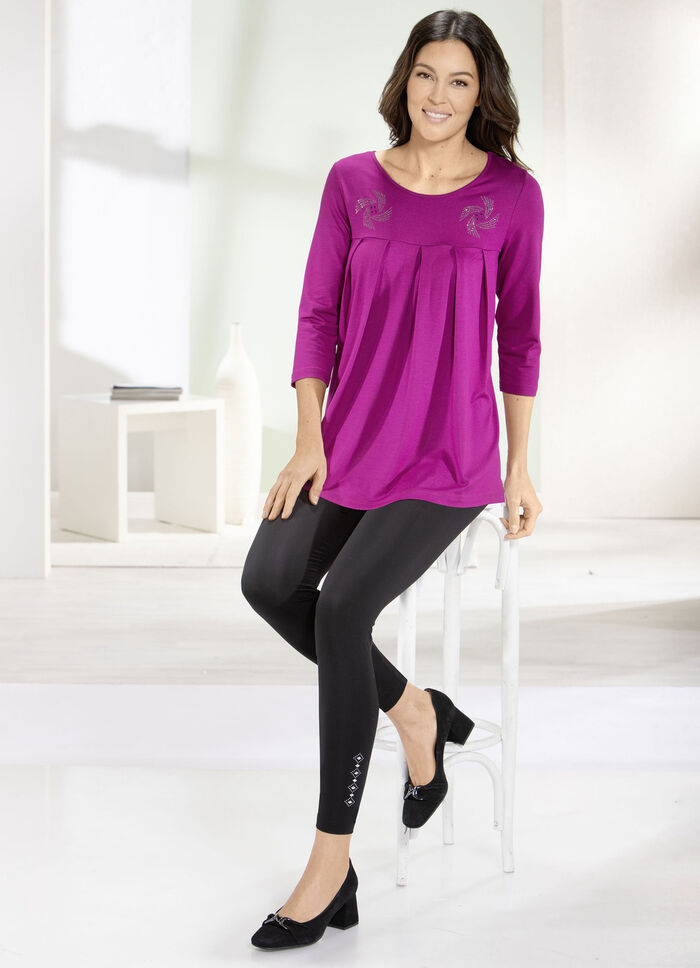 Leggings med ett elegant, glänsande dekorativt motiv, 