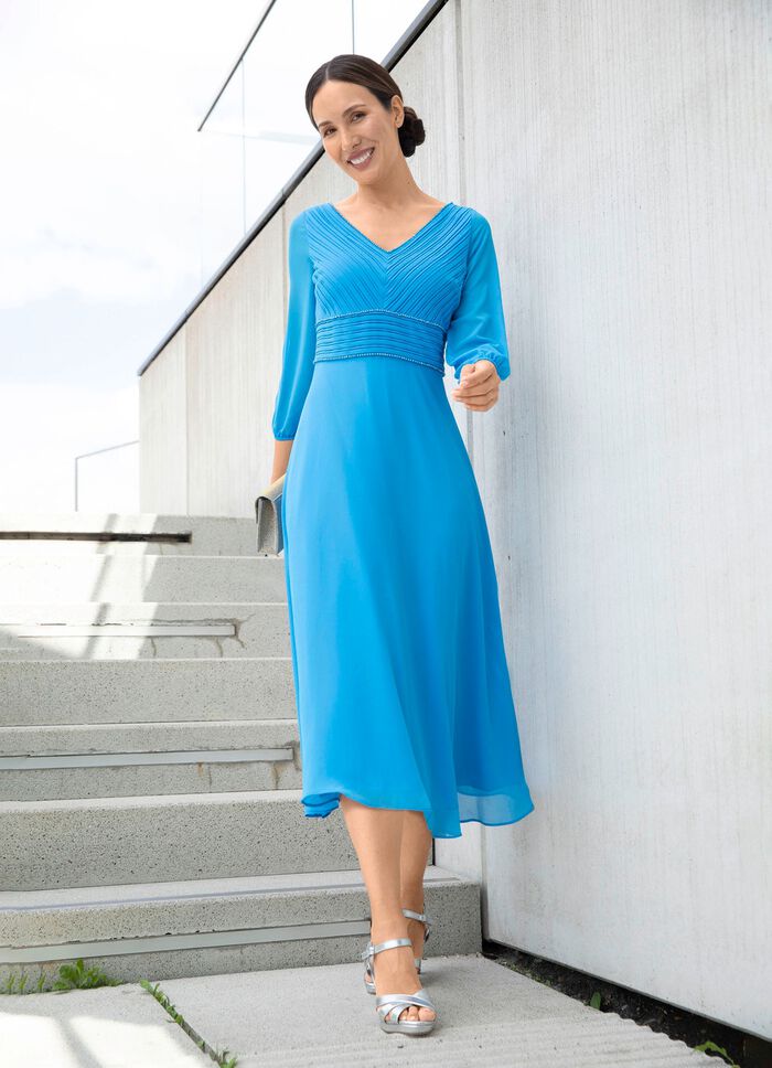 Kl&auml;nning med fina dekorativa kulor 