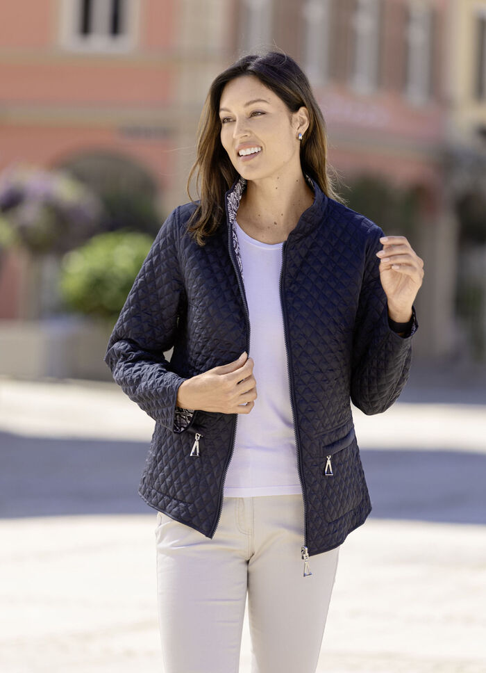 Funktionell v&auml;ndbar jacka med reptildesign 