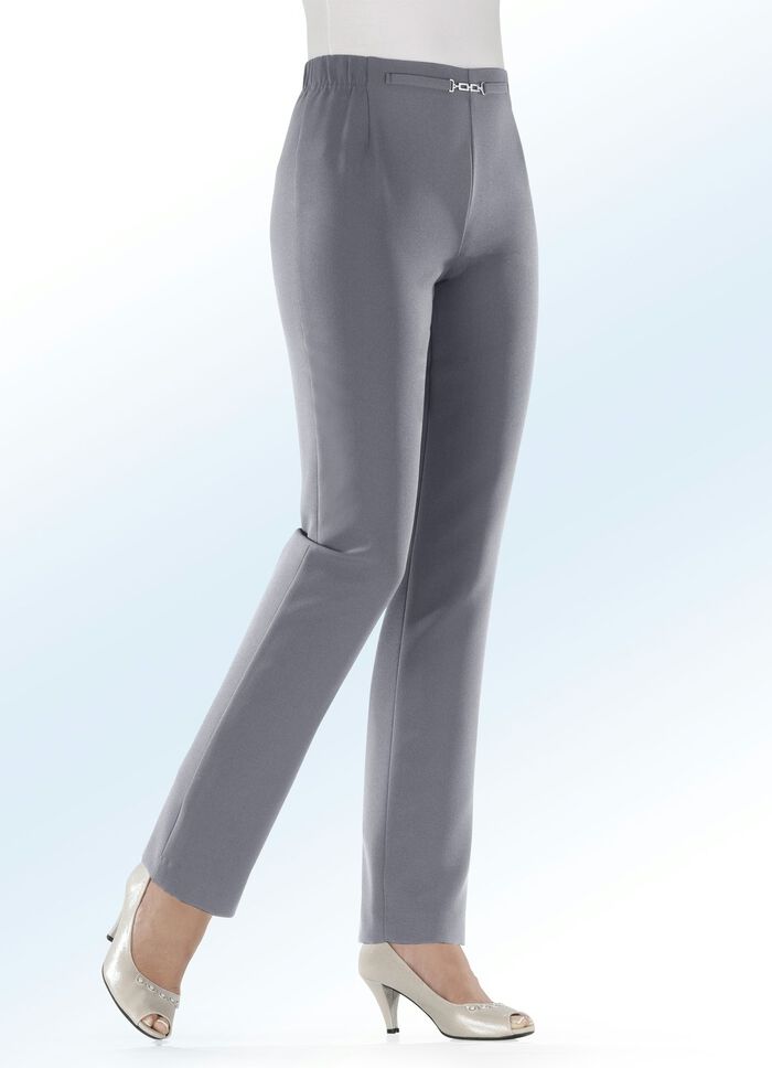 Byxor med dekorativ detalj framtill vid midjan 