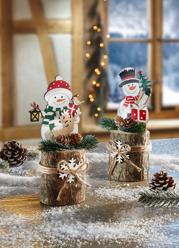 Snögubbe på en trädstam, set om 2 