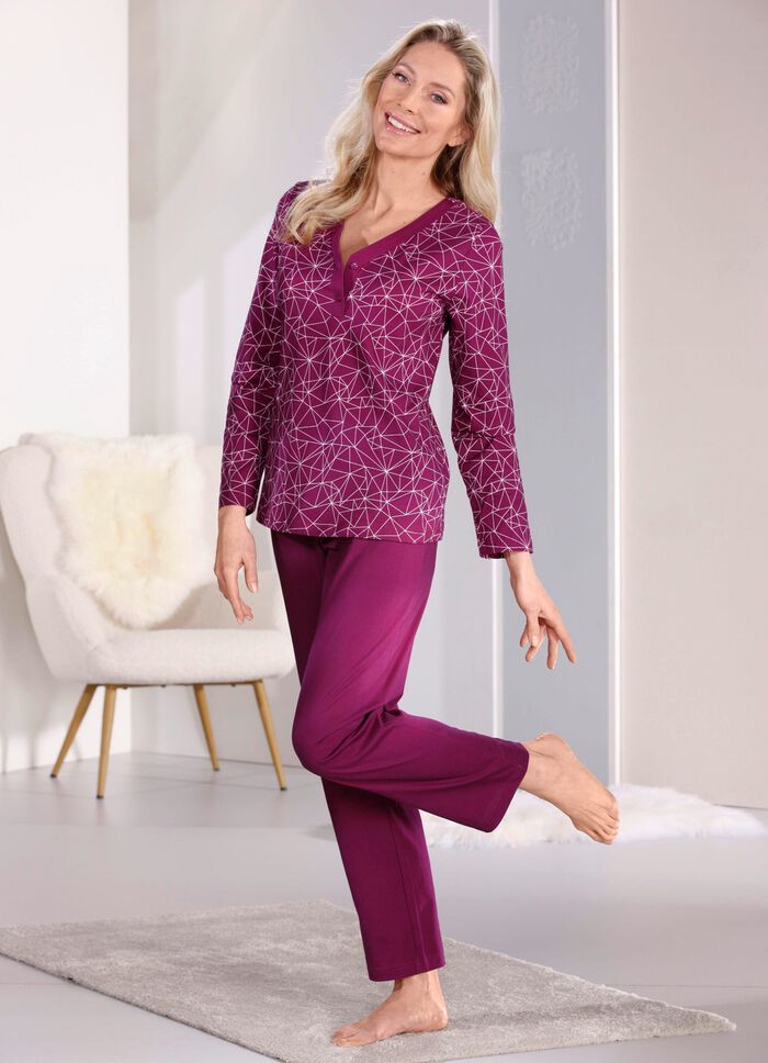 Pyjamas med knappar framtill och l&aring;nga &auml;rmar 