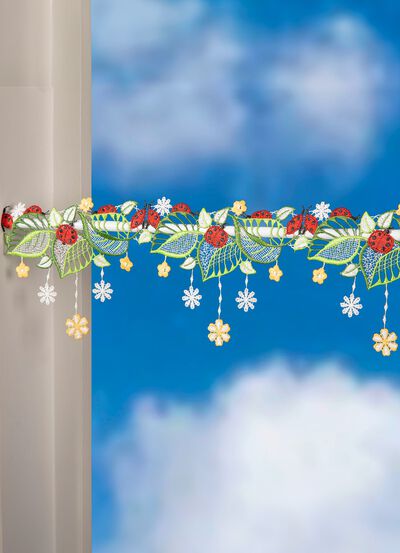 Stolpdekoration med nyckelpigamotiv 