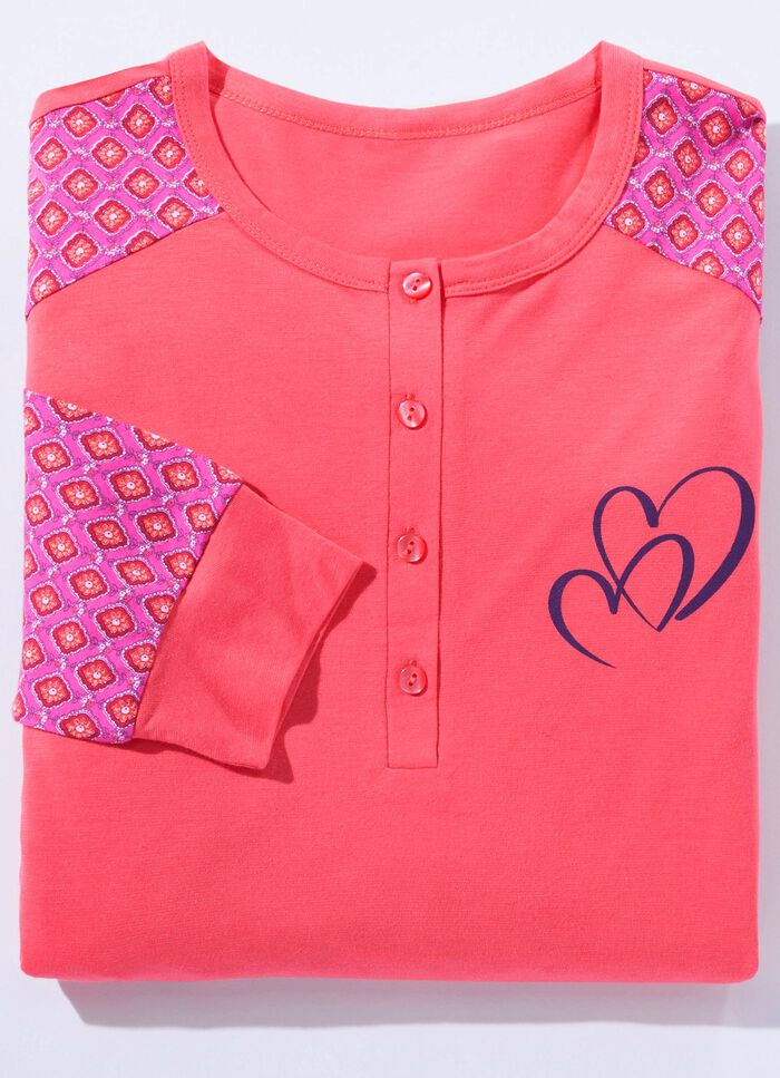 F&ouml;rpackning om tv&aring; nattlinnen med sidoslitsar och knappsl&aring; 