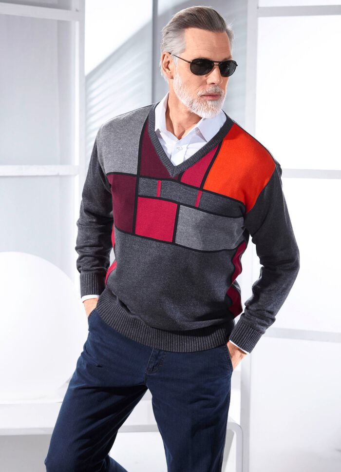 Intressant V-ringad tr&ouml;ja med grafiskt m&ouml;nster 