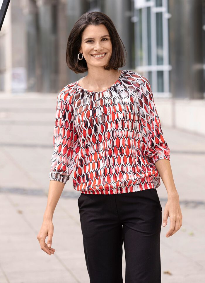 Tunika med vackra veck 