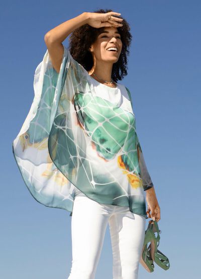 Ponchotunika med integrerat linne 