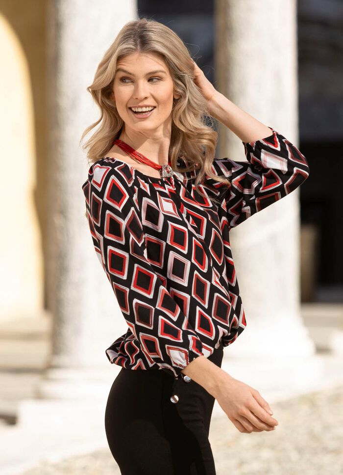 Tunika med f&auml;rgstarkt tryck 