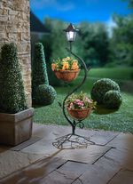 V&auml;xtst&auml;llning med solcellslampa 