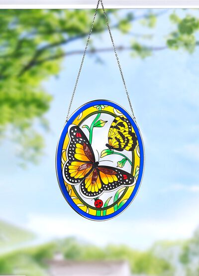 Glasbild med metallram och metallkedja 