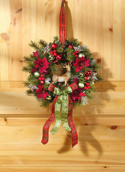 V&auml;ggkrans med julstj&auml;rnablommor 