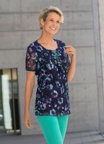 Skjorta med spetskant under 