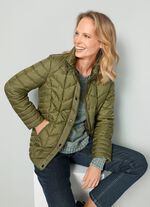 Quiltad jacka med dragkedja under tryckarfodralet 