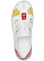 Andrea Conti tofflor i nappal&auml;der VIT-F&Auml;RGERIGT