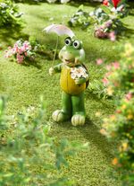 Sk&ouml;ldpadda med solblomma och paraply 