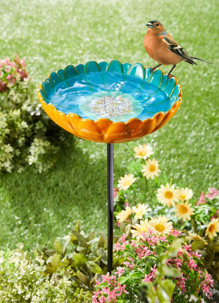 F&aring;gelbadblomma av glaserad keramik 