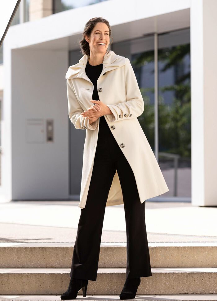 Kappa med knappsl&aring; 