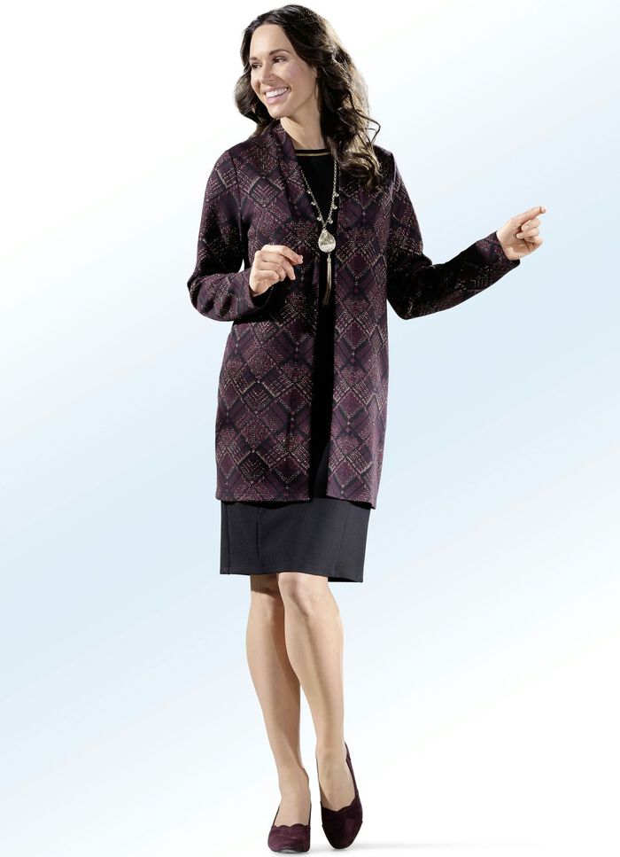 Kl&auml;nning med jacka med guldf&auml;rgad gl&auml;nsande tr&aring;d 