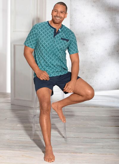 Shorty med knappsl&aring; och br&ouml;stficka / h&aring;llbar bomullsodling 