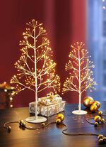 Belyst bordsdekoration i metall 