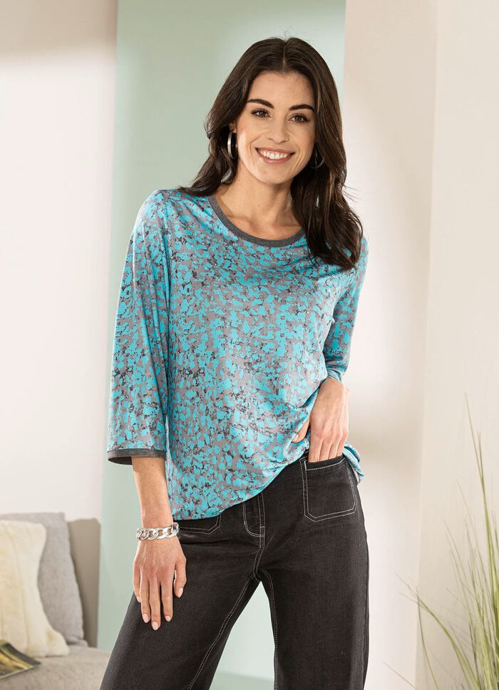 Skjorta med silverf&auml;rgade dekorativa tallrikar 