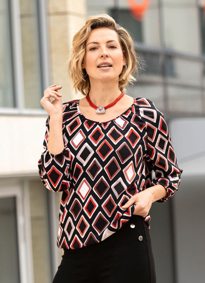 Tunika med f&auml;rgstarkt tryck 