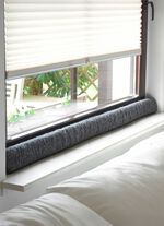 Dragskydd i ull f&ouml;r f&ouml;nster 