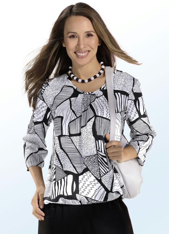 Tunika med vackra veck vid halsringningen 