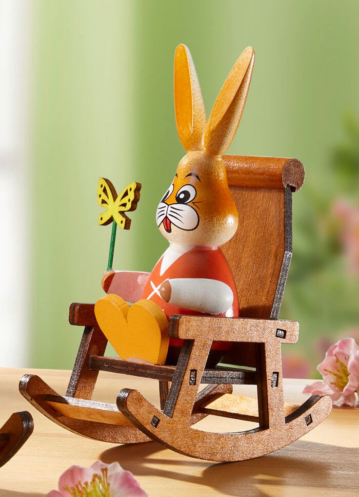 Kaniner i en gungstol 