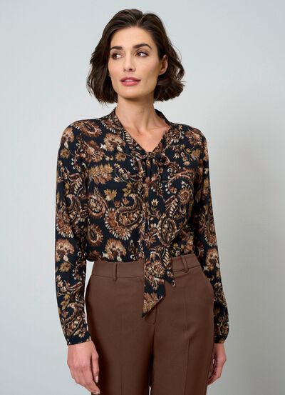 Blus med knytringning 