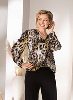 Tunika med smockade kanter 