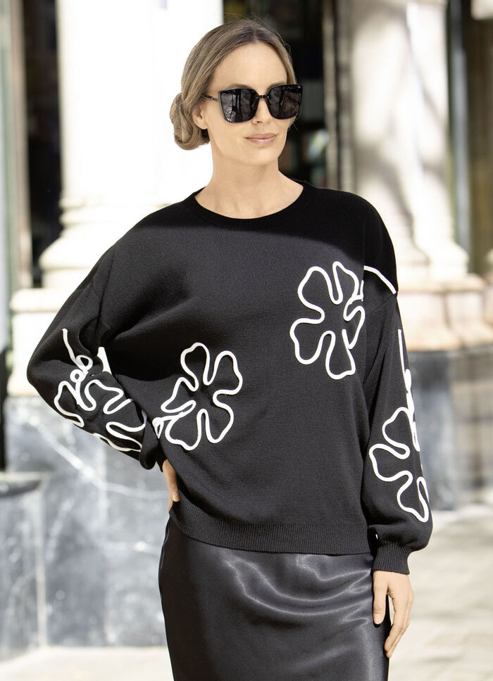 Tröja med genomarbetade blomapplikationer 