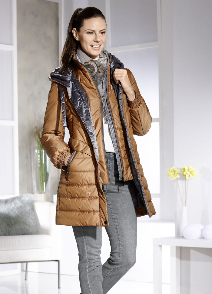 Kort kappa med v&auml;stinl&auml;gg 